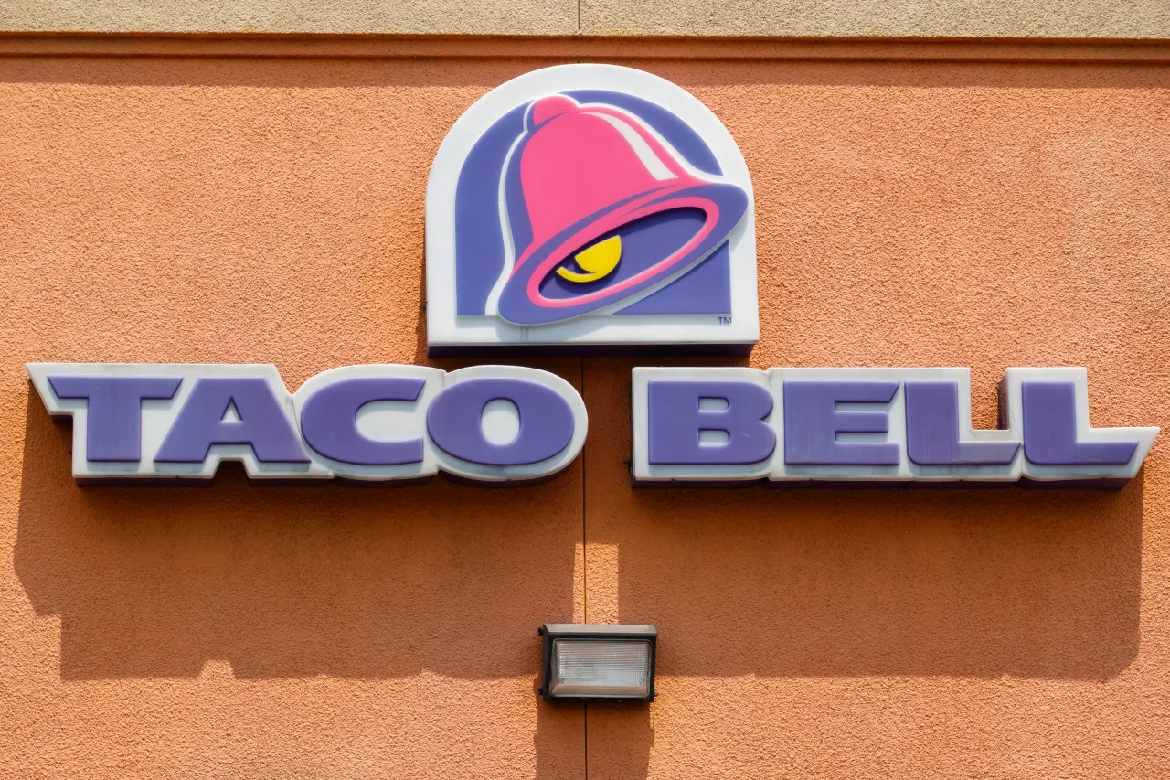 A Taco Bell logo is displayed outside their restaurants on August 2, 2025 in San Diego, California.