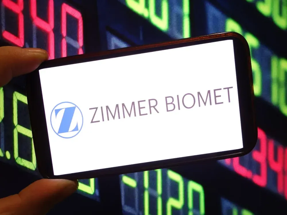In this photo illustration, the Zimmer Biomet company logo is seen displayed on a smartphone screen. (Photo Illustration by Piotr Swat/SOPA Images/LightRocket via Getty Images)