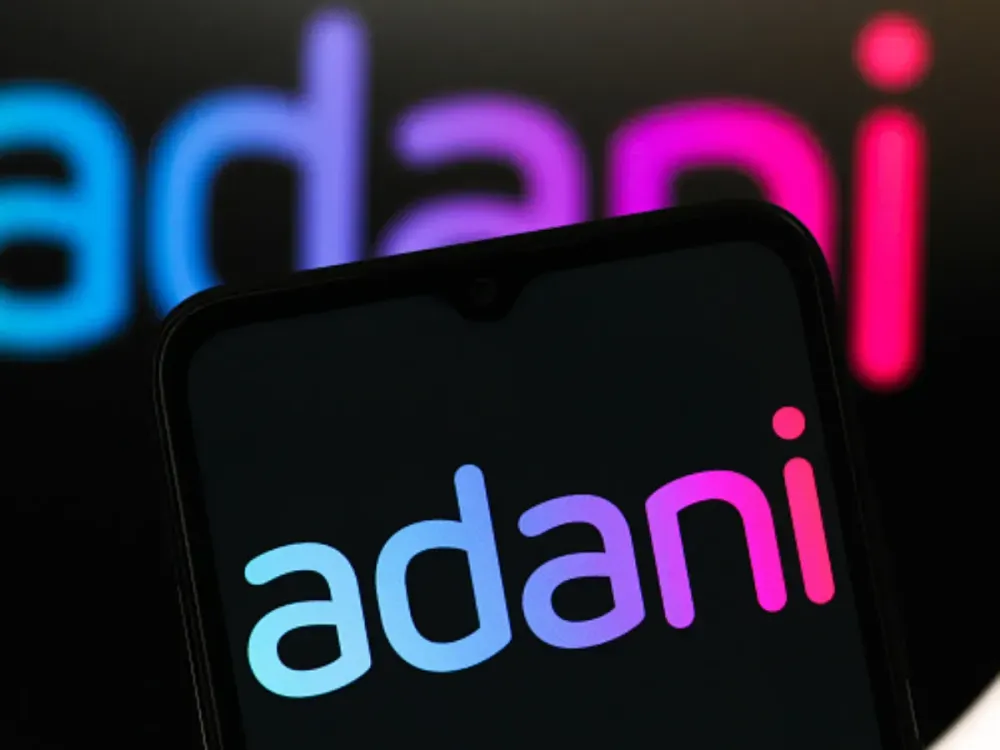 In this photo illustration, the Adani Enterprises logo is seen displayed on a smartphone screen. (Photo Illustration by Thomas Fuller/SOPA Images/LightRocket via Getty Images)