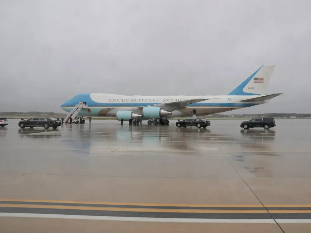 Air Force One is seen through the window of a Press Van in U.S. President Donald Trump's motorcade