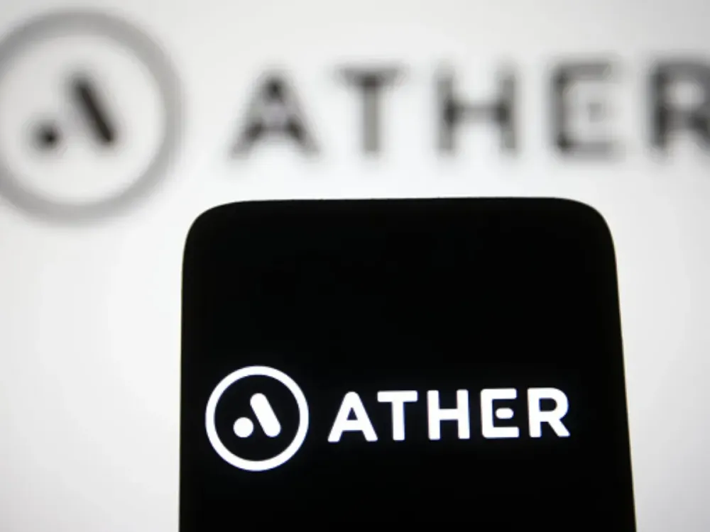 In this photo illustration, an Ather Energy Pvt. Ltd. logo is seen on a smartphone and a computer screen. (Photo Illustration by Pavlo Gonchar/SOPA Images/LightRocket via Getty Images)