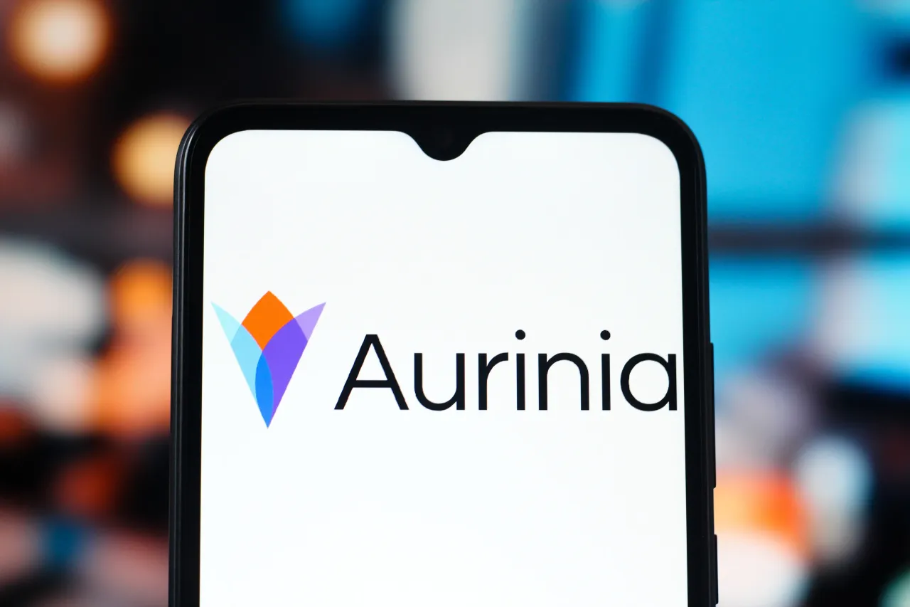 In this photo illustration, the Aurinia Pharmaceuticals logo is seen displayed on a smartphone screen