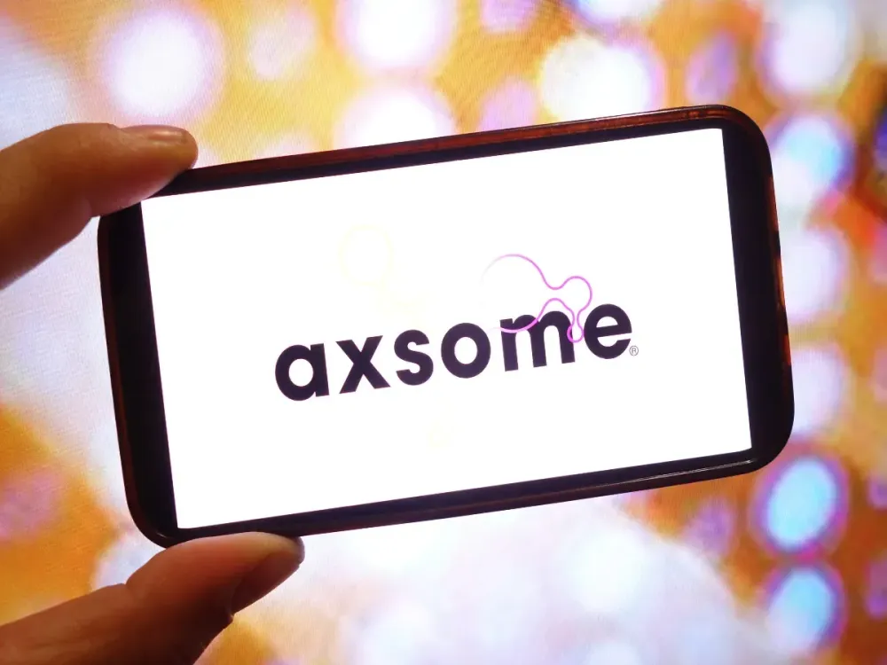 In this photo illustration, the Axsome Therapeutics company logo is seen displayed on a smartphone screen. (Photo Illustration by Piotr Swat/SOPA Images/LightRocket via Getty Images)