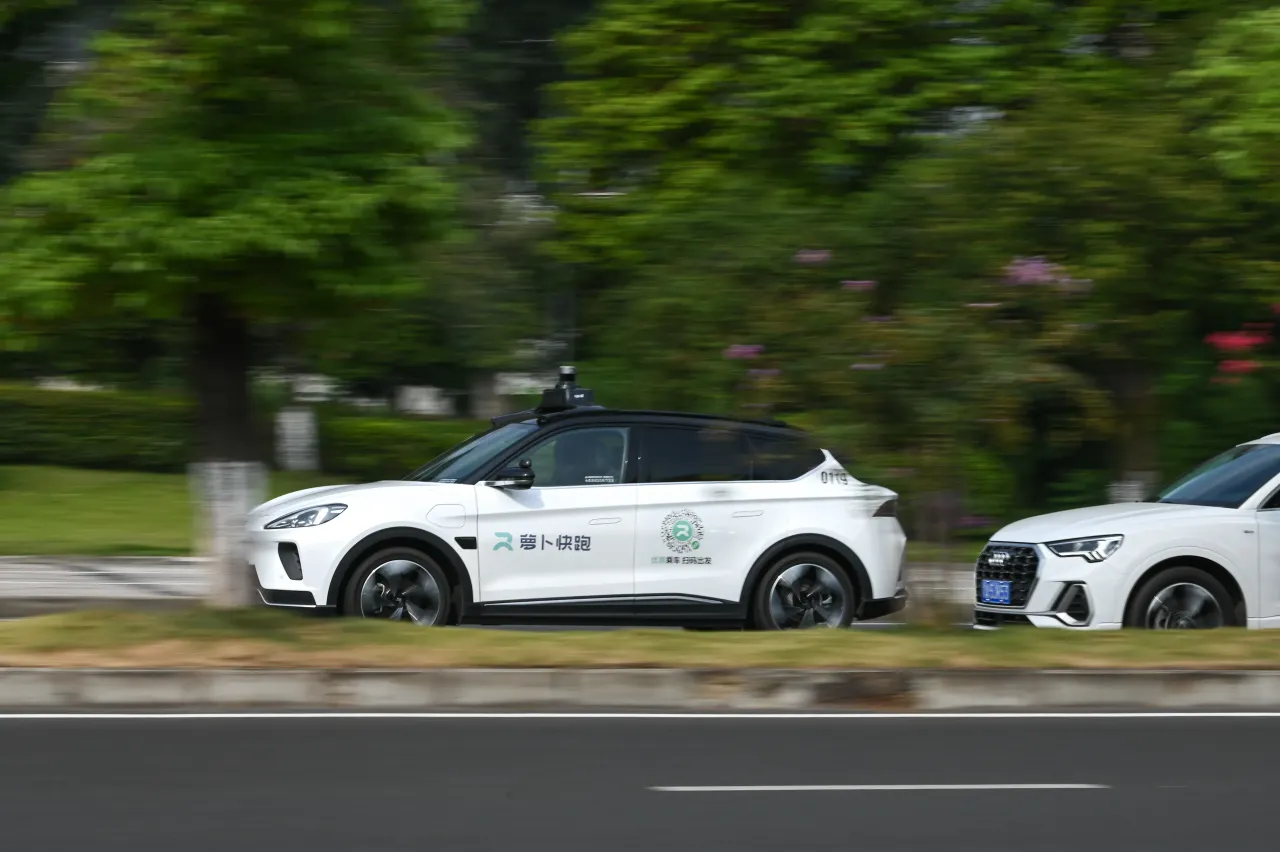 Baidu's Apollo Go Robotaxi drives on the street on September 2, 2023 in Chongqing, China