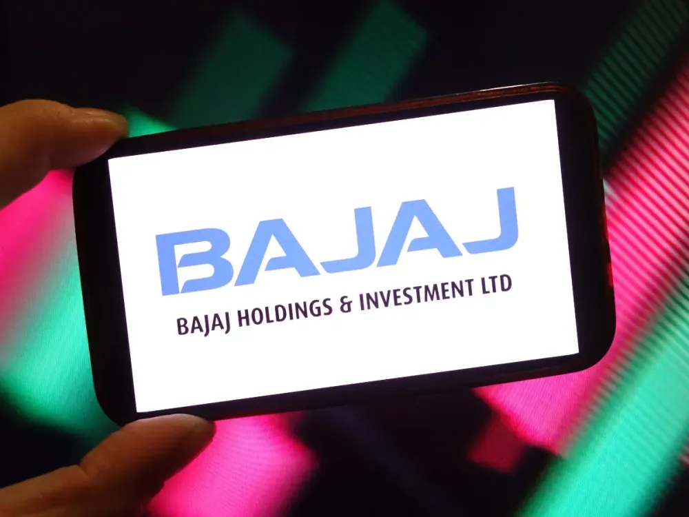 In this photo illustration, the Bajaj Holdings and Investment company logo is seen displayed on a smartphone screen. (Photo Illustration by Piotr Swat/SOPA Images/LightRocket via Getty Images)