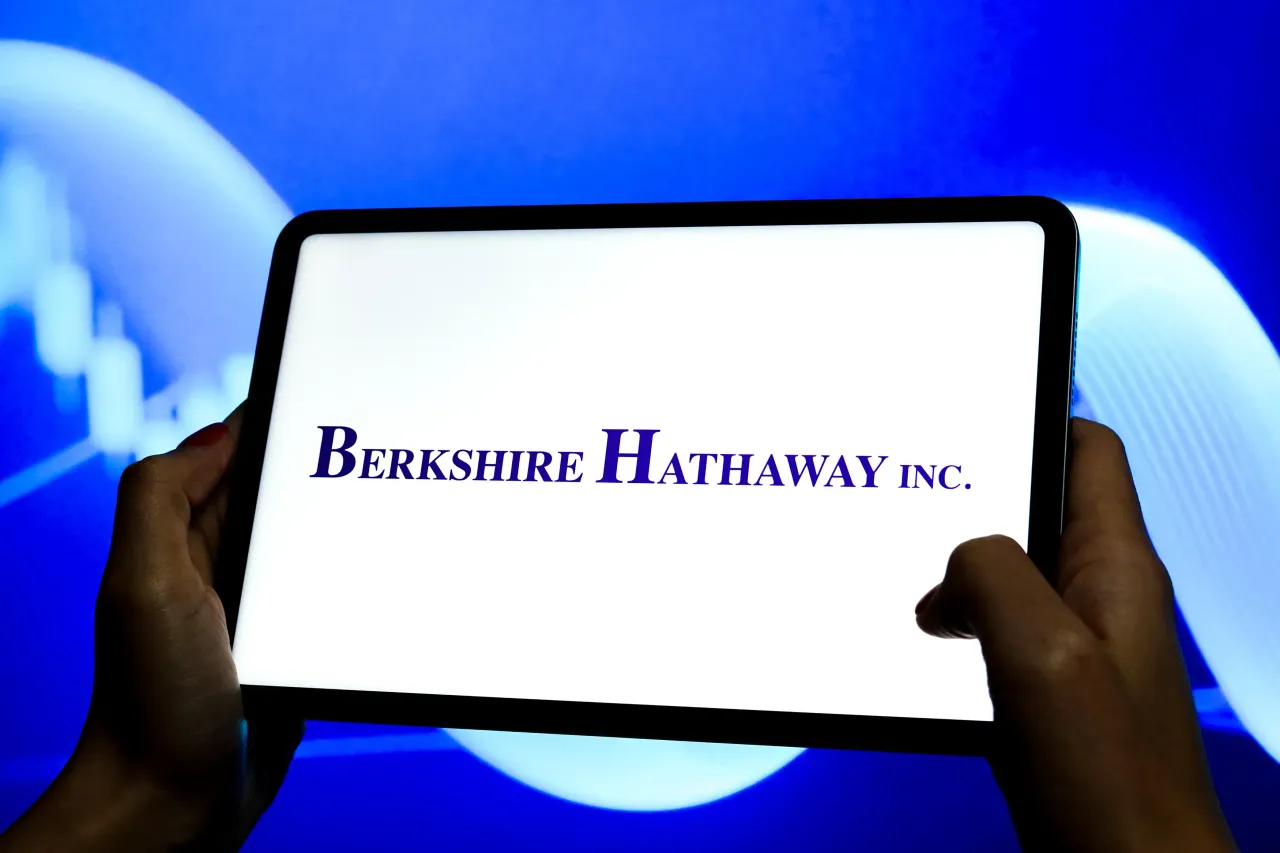 In this photo illustration, the logo of Berkshire Hathaway Inc. is displayed on the screen of a tablet