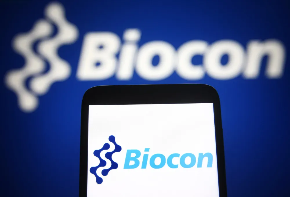 In this photo illustration a Biocon Limited logo is seen on a smartphone and a pc screen. (Photo Illustration by Pavlo Gonchar/SOPA Images/LightRocket via Getty Images)