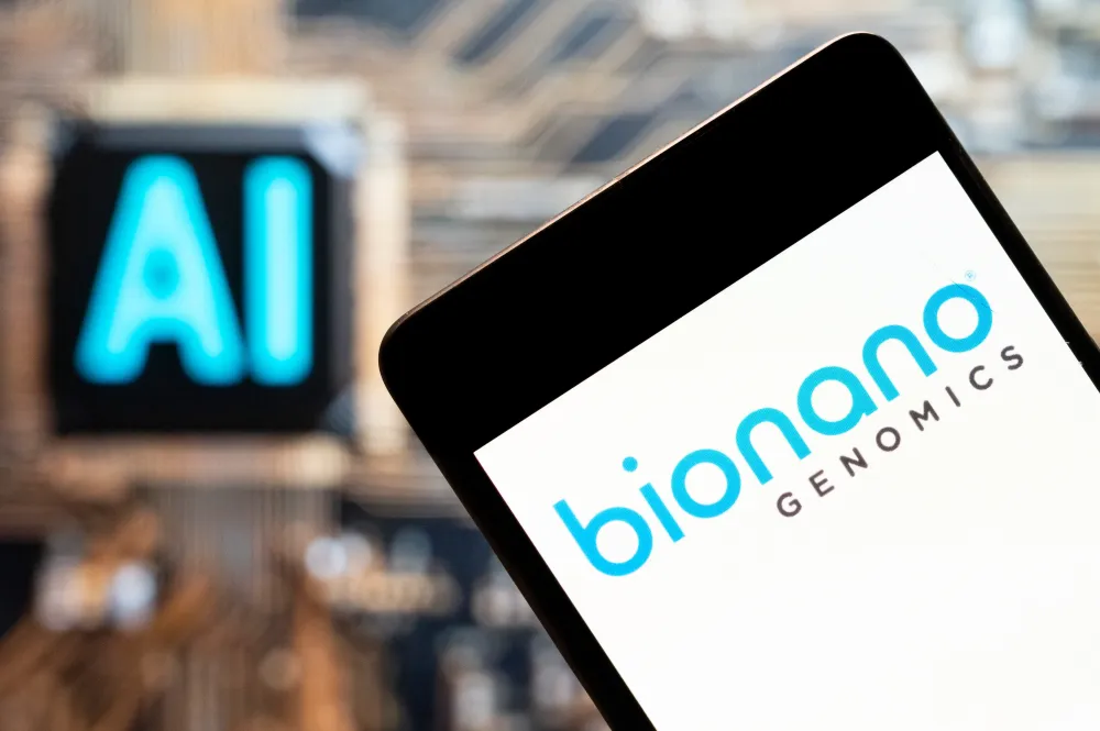 Bionano Genomics (NASDAQ: BNGO) logo seen displayed on a smartphone with an Artificial intelligence (AI) chip and symbol in the background. (Photo Illustration by Budrul Chukrut/SOPA Images/LightRocket via Getty Images)