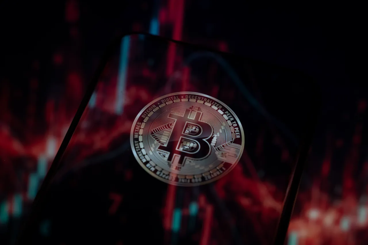 The global cryptocurrency market experienced a sharp decline, with Bitcoin falling below the key threshold of $75,000, dragging major altcoins down with it in Creteil, France, on February 3, 2026. (Photo by Samuel Boivin/NurPhoto via Getty Images)