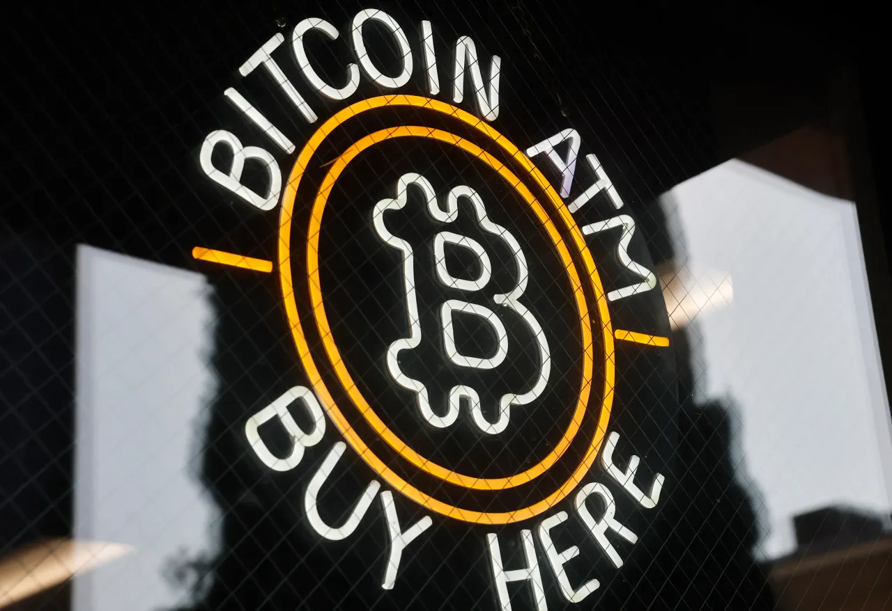 A sign advertises a Bitcoin ATM at a gas station on July 16, 2025 near Pasadena, California. (Photo by Mario Tama/Getty Images)