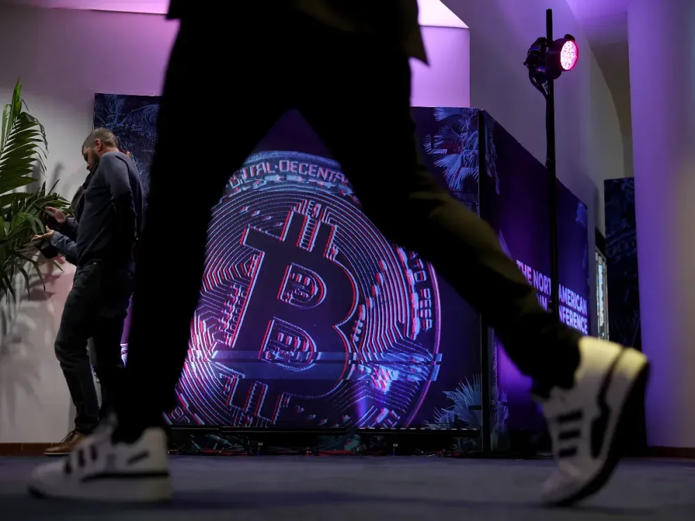 People walk through the North American Bitcoin Conference held at the James L Knight Center on January 18, 2022 in Miami, Florida. (Photo by Joe Raedle/Getty Images)