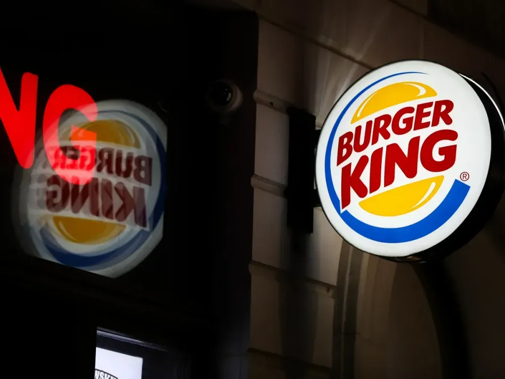 The Burger King logo is seen at night on the street in Krakow, Poland. (Photo by Klaudia Radecka/NurPhoto via Getty Images)