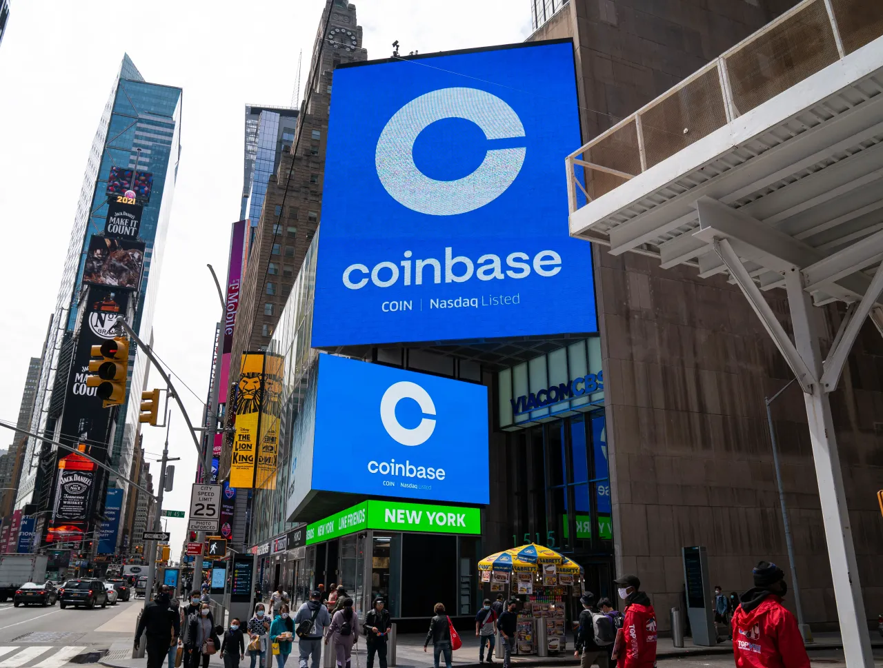 Monitors display Coinbase signage during the company's initial public offering (IPO) at the Nasdaq market site April 14, 2021 in New York City.