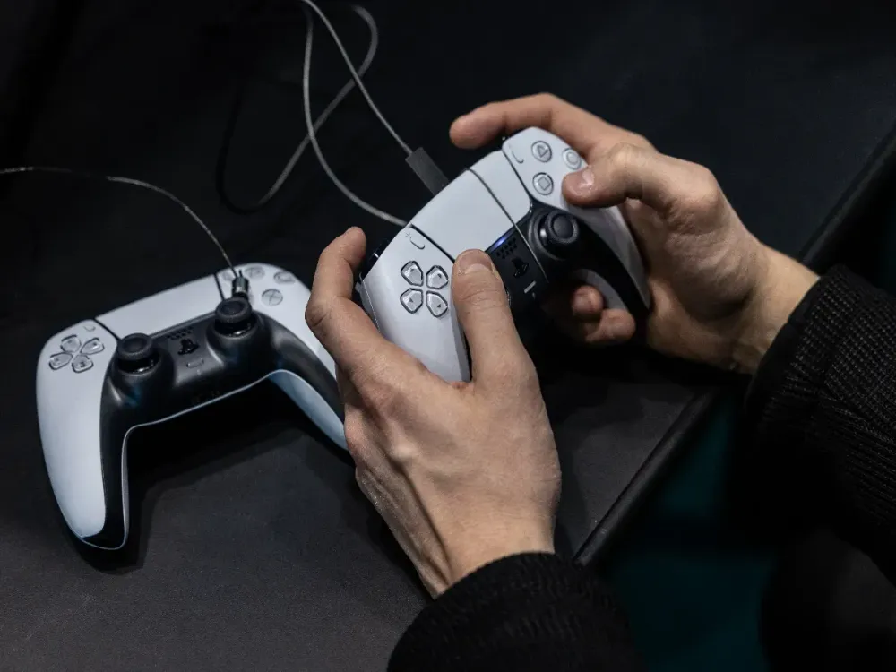 A man uses a Playstation gamepad during during Milan Games Week & Cartoomics 2024 at Fiera Milano Rho on November 22, 2024 in Milan, Italy. (Photo by Emanuele Cremaschi/Getty Images)