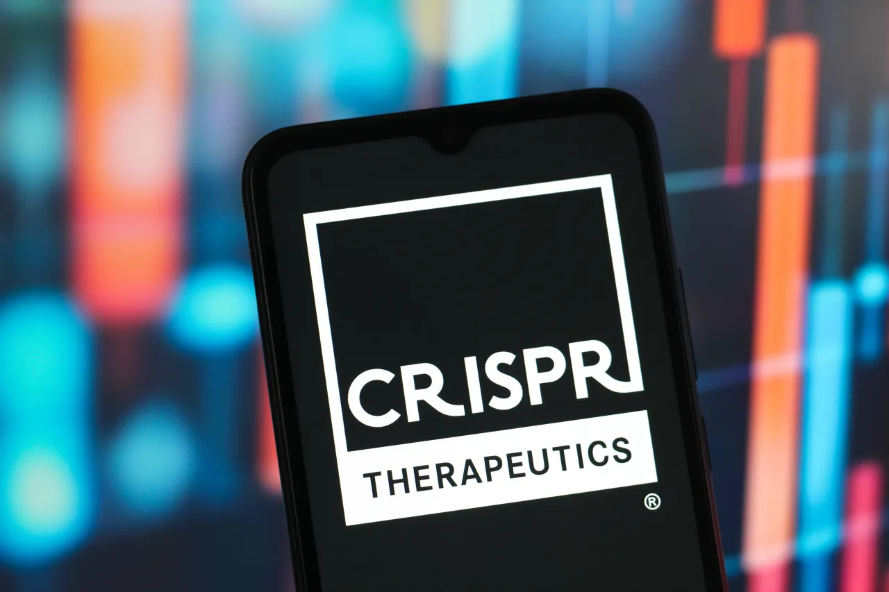 In this photo illustration, the Crispr Therapeutics logo is seen displayed on a smartphone screen. (Photo Illustration by Thomas Fuller/SOPA Images/LightRocket via Getty Images)