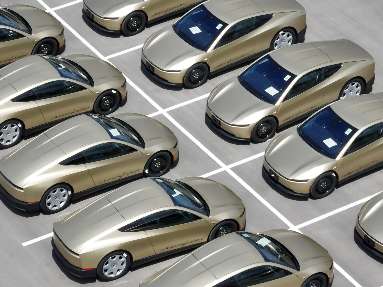 Tesla Cybercabs are lined up on a lot at Tesla Giga Texas in Austin, Wednesday, April 8, 2026. (Jay Janner/The Austin American-Statesman via Getty Images)