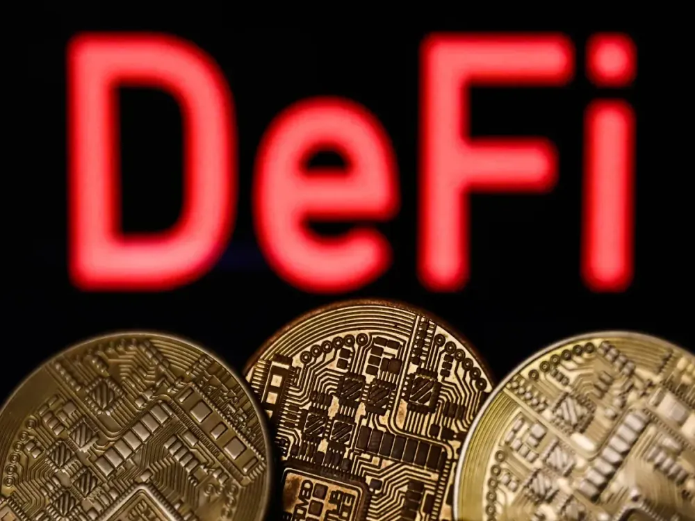 In this photo illustration, a DeFi logo is displayed on a smartphone with stock market percentages in the background. (Photo Illustration by Omar Marques/SOPA Images/LightRocket via Getty Images)