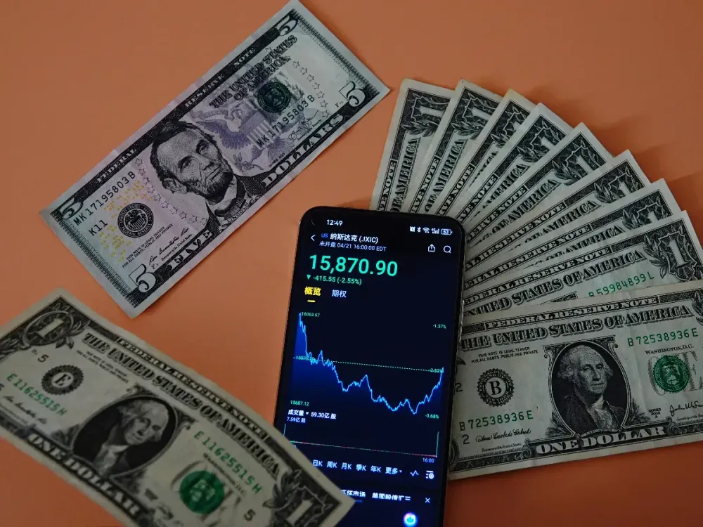 The Dow Jones Industrial Average, S&P 500 Index, Nasdaq Composite Index, and US Dollar are in Yichang, Hubei Province, China, on April 22, 2025. (Photo by Costfoto/NurPhoto via Getty Images)