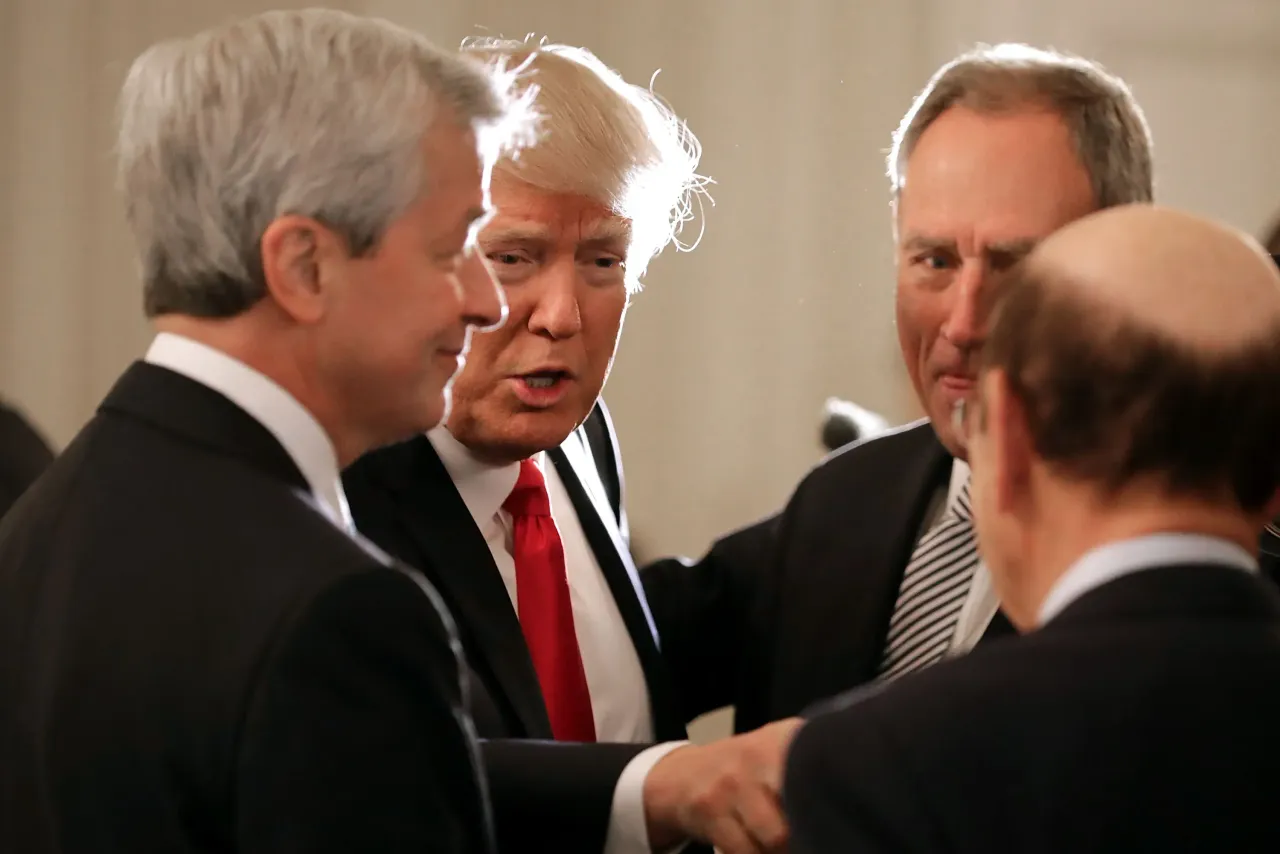 U.S. President Donald Trump greets JPMorgan Chase CEO Jamie Dimon and other guests at the beginning of a policy forum in the State Dining Room at the White House February 3, 2017