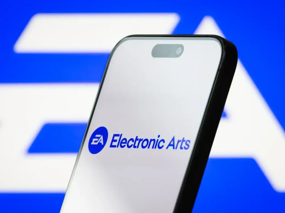 The logo of Electronic Arts Inc. displayed on a smartphone screen, with the company's iconic EA branding visible in the background, on May 04, 2025, in Chongqing, China.  (Photo illustration by Cheng Xin/Getty Images)