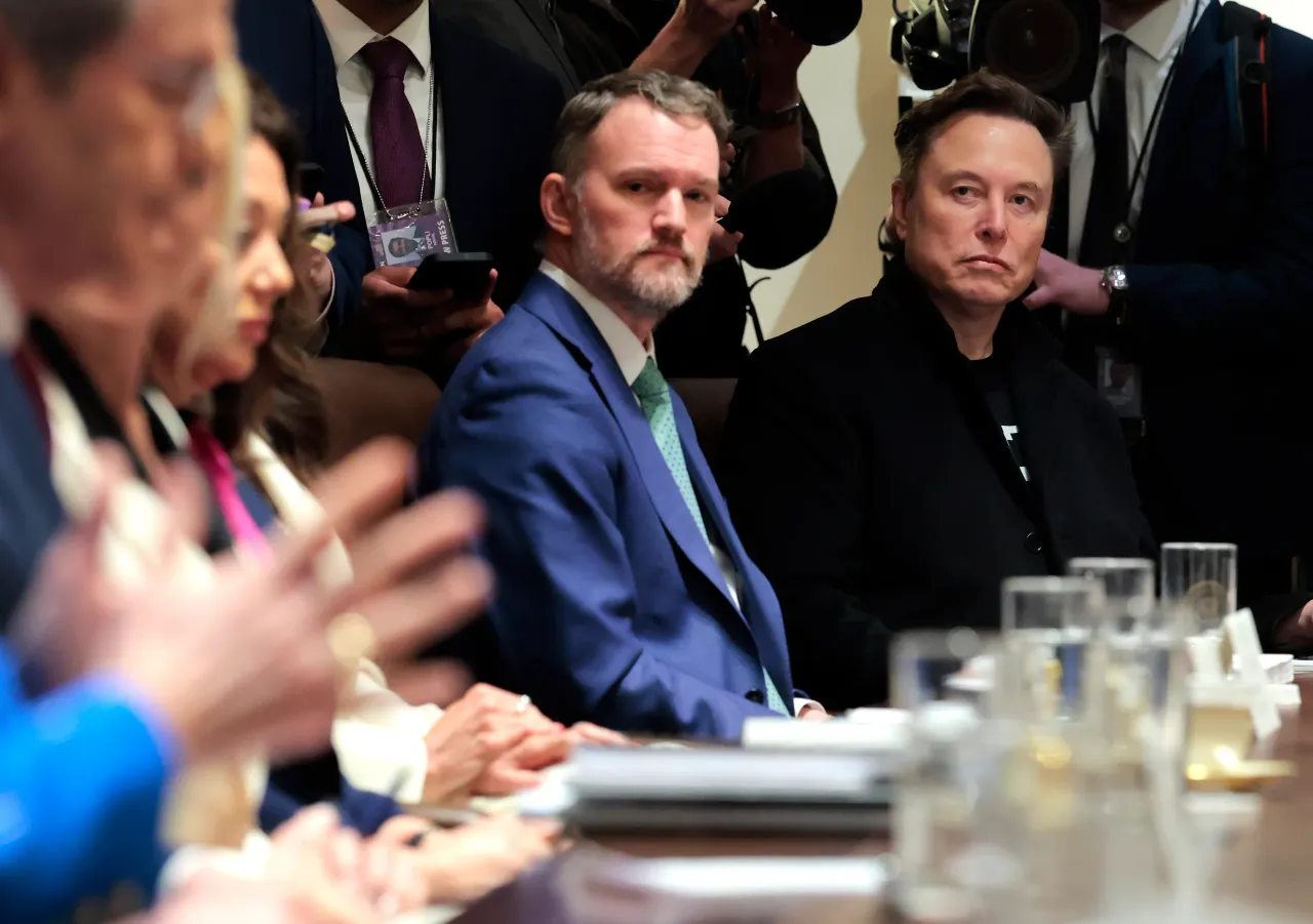 Elon Musk (R), Tesla and SpaceX CEO and Senior Advisor to the President, sits next to U.S. Trade Representative Jamieson Greer during a Cabinet meeting at the White House on April 10, 2025. (Photo by Anna Moneymaker/Getty Images)