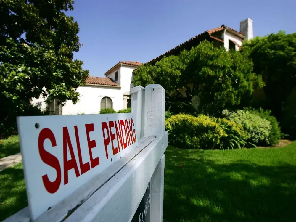 A house is seen with a "For Sale" sign on it on July 25, 2005 in Pasadena, California. (Photo by David McNew/Getty Images)