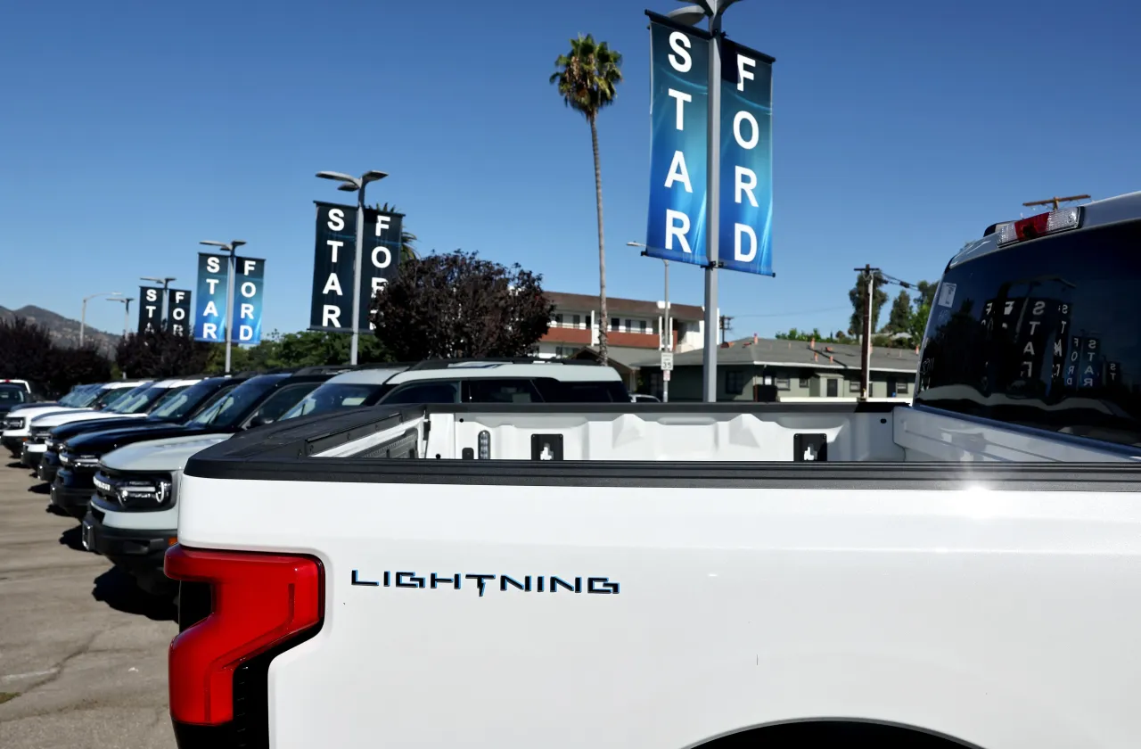 A Ford F-150 Lightning electric pickup truck is displayed for sale at a Ford dealership on August 21, 2024. (Photo by Mario Tama/Getty Images)