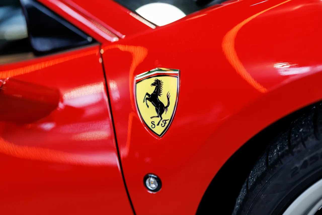 The Ferrari brand logo, the coat of arms with the lettering and a rising horse, can be seen on a vehicle from the sports car manufacturer in Munich on February 9, 2026. Photo: Matthias Balk/dpa (Photo by Matthias Balk/picture alliance via Getty Images)