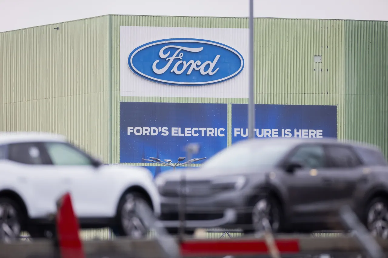 Ford Explorer electric cars are parked on car transporters on the Ford factory premises. (Photo by Rolf Vennenbernd/picture alliance via Getty Images)