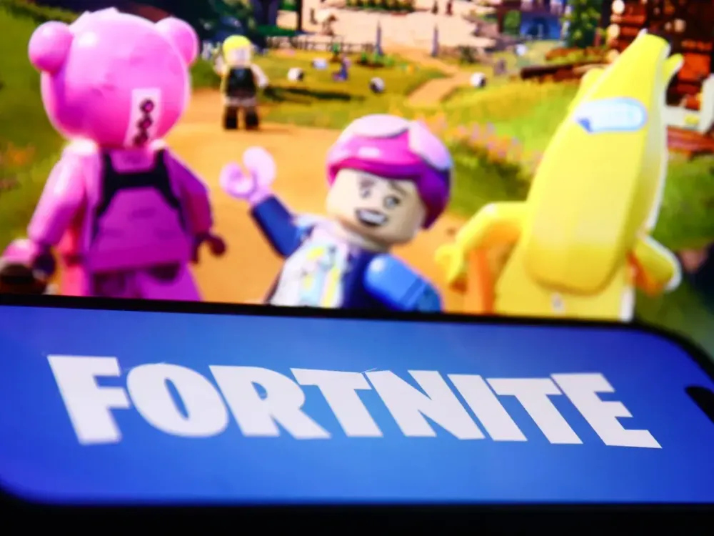 Lego Fortnite website displayed on a laptop screen and Fortnite logo displayed on a phone screen are seen in this illustration photo taken in Krakow, Poland on December 8, 2023. (Photo by Jakub Porzycki/NurPhoto via Getty Images)