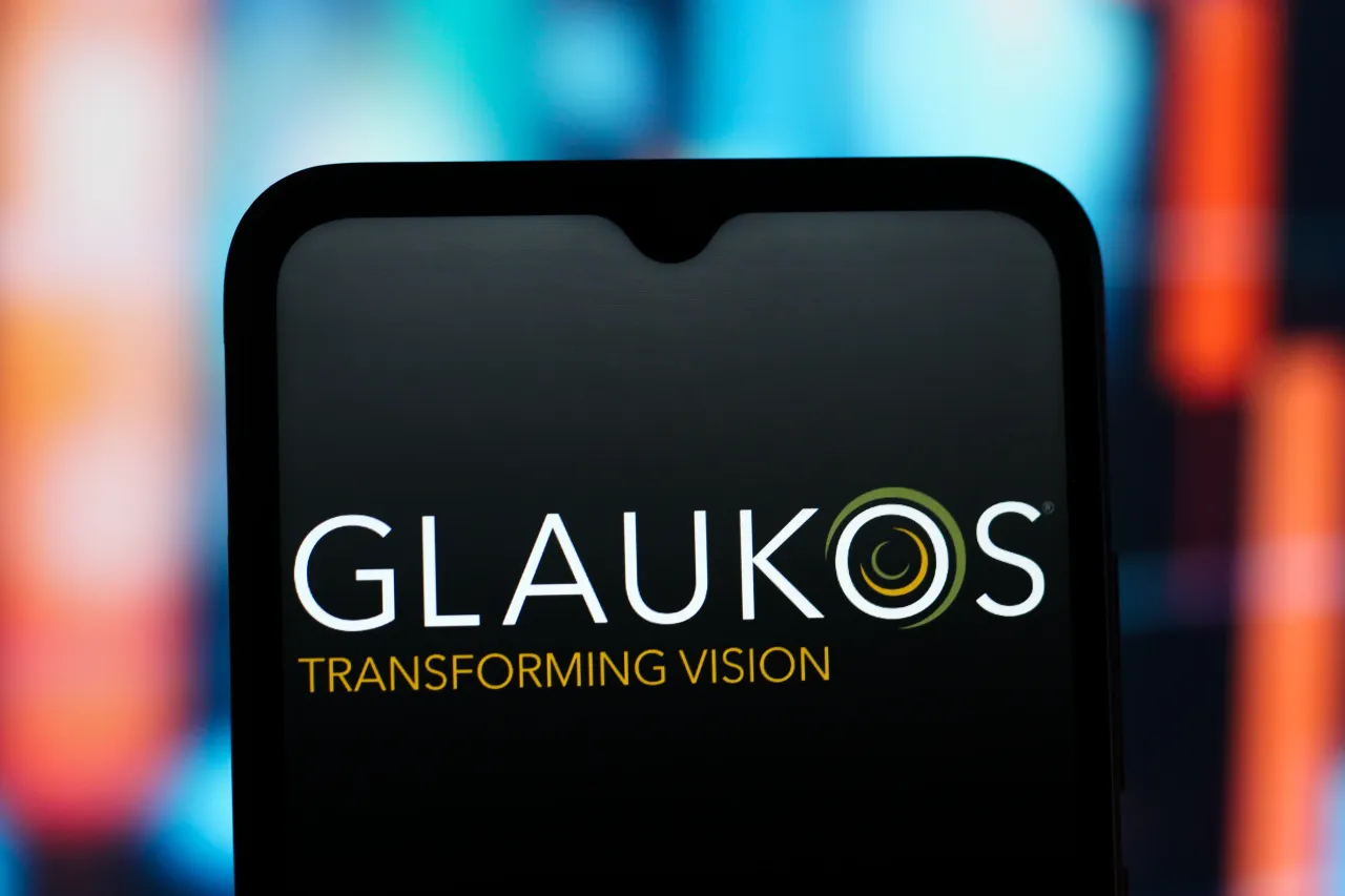 In this photo illustration, the Glaukos Corporation logo is seen displayed on a smartphone screen. (Photo Illustration by Thomas Fuller/SOPA Images/LightRocket via Getty Images)