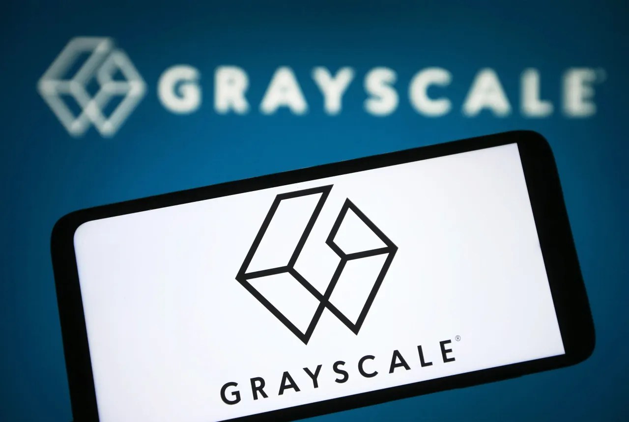 In this photo illustration, Grayscale Investments logo is seen on a smartphone and on a pc screen. (Photo Illustration by Pavlo Gonchar/SOPA Images/LightRocket via Getty Images)