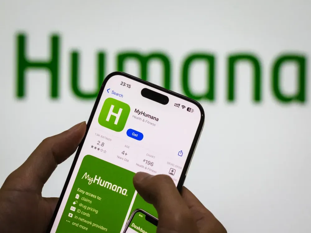 The MyHumana app page is displayed on a smartphone in the Apple App Store in front of the Humana Inc logo on October 30, 2024 in Chongqing, China. (Photo by Cheng Xin/Getty Images)