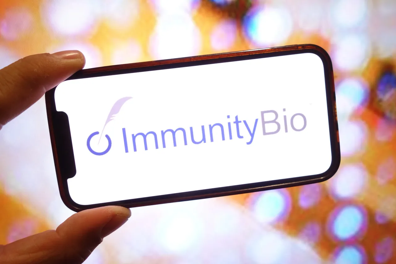 In this photo illustration, an ImmunityBio company logo is seen displayed on a smartphone screen. (Photo Illustration by Piotr Swat/SOPA Images/LightRocket via Getty Images)