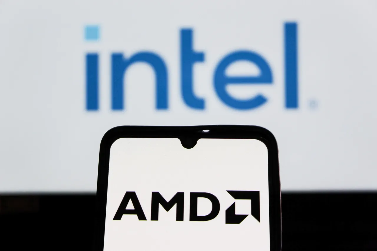 In this photo illustration, the AMD (Advanced Micro Devices) logo is seen displayed on a smartphone screen with an Intel logo in the background. (Photo Illustration by Algi Febri Sugita/SOPA Images/LightRocket via Getty Images)