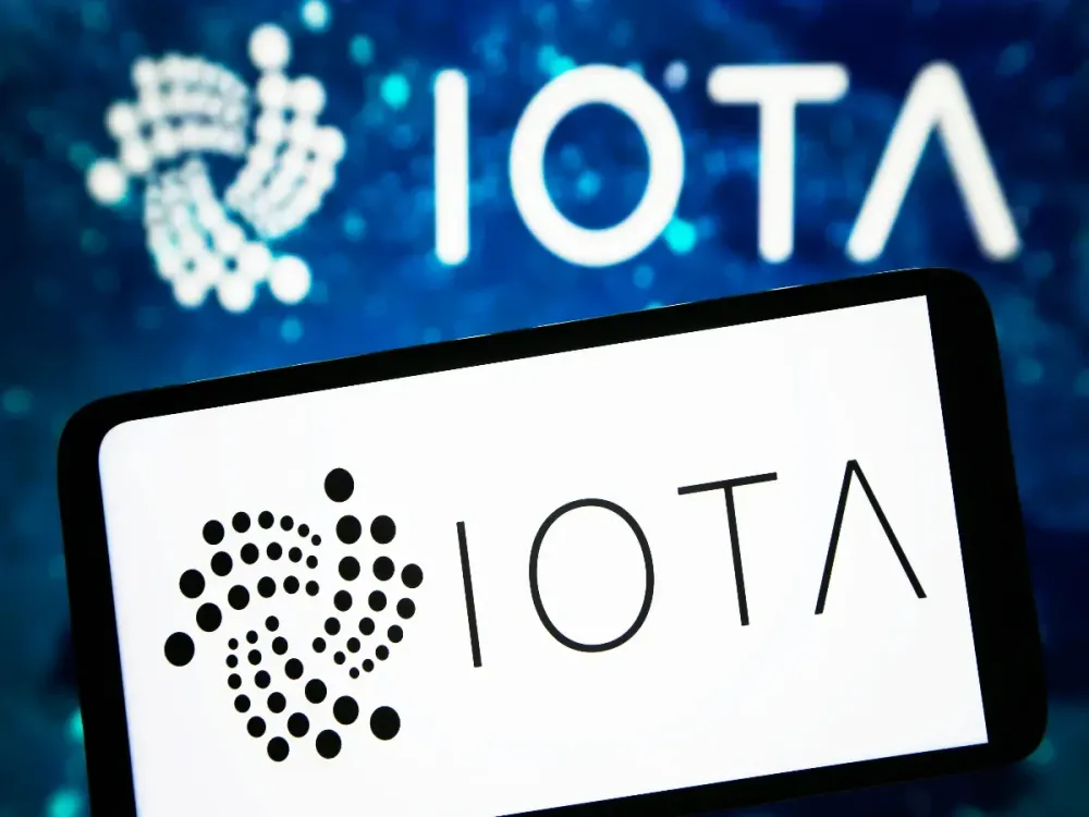 In this photo illustration, IOTA logo is seen on a smartphone screen. (Photo Illustration by Pavlo Gonchar/SOPA Images/LightRocket via Getty Images)