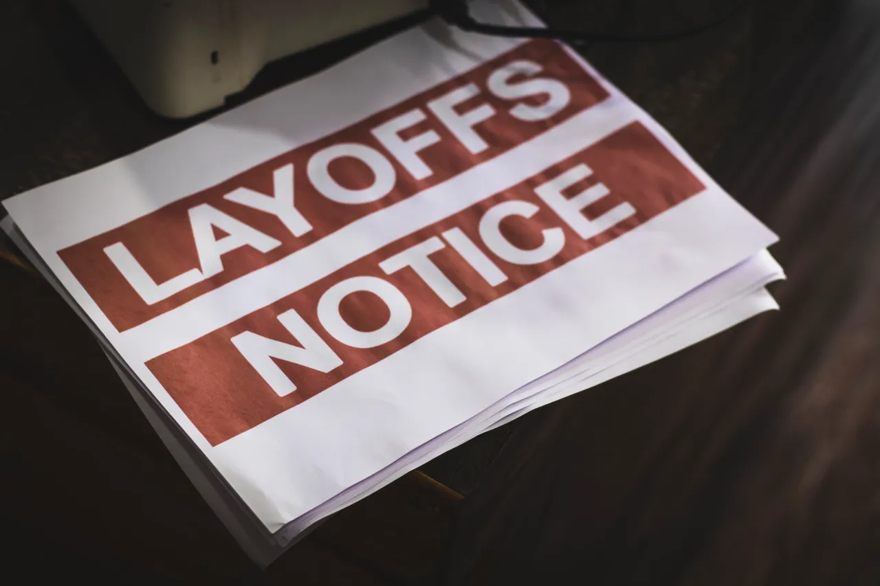 Merck (MRK), Bristol Myers Squibb (BMY), Novartis (NVS), and multiple UnitedHealth Group (UNH) Optum divisions filed advance notices of job cuts extending well into 2026. (Photo credit: Getty Images)