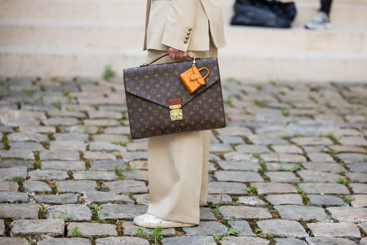 A guest wears Louis Vuitton bag outside Tony Ward during the Haute Couture Fall/Winter 2025/2026 as part of Paris Fashion Week on July 07, 2025 in Paris, France. 