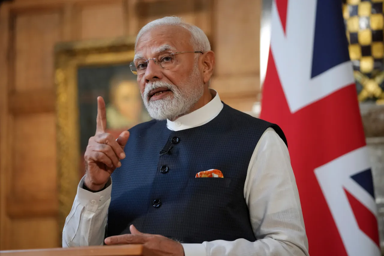 Prime Minister Narendra Modi of India gestures during a press conference with Britain's Prime Minister Keir Starmer after signing a free trade agreement at Chequers. (Photo by Kin Cheung - WPA Pool/Getty Images)