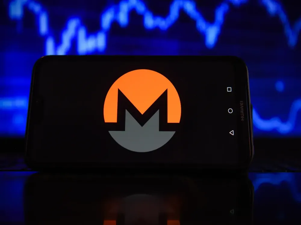 In this photo illustration a Monero logo seen displayed on a smartphone with stock market percentages in the background. (Photo Illustration by Omar Marques/SOPA Images/LightRocket via Getty Images)