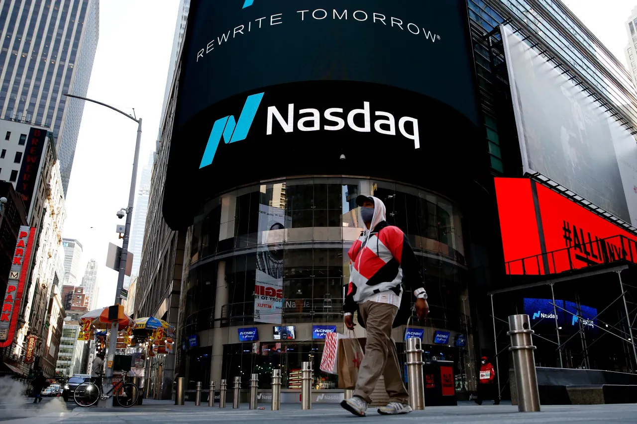 Representative image of a man walking in front of the Nasdaq building at Times Square in New York. (Photo by John Smith/VIEWpress)