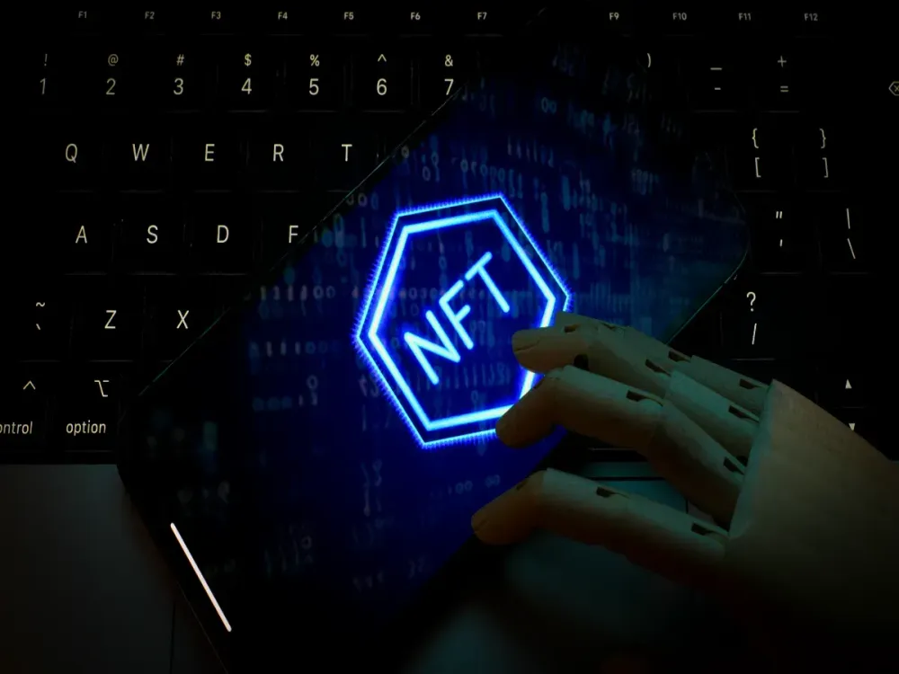 NFT logo is seen on the screen of a mobile device in this photo illustration taken on 01 November, 2023 in Warsaw, Poland. (Photo by Jaap Arriens/NurPhoto via Getty Images)