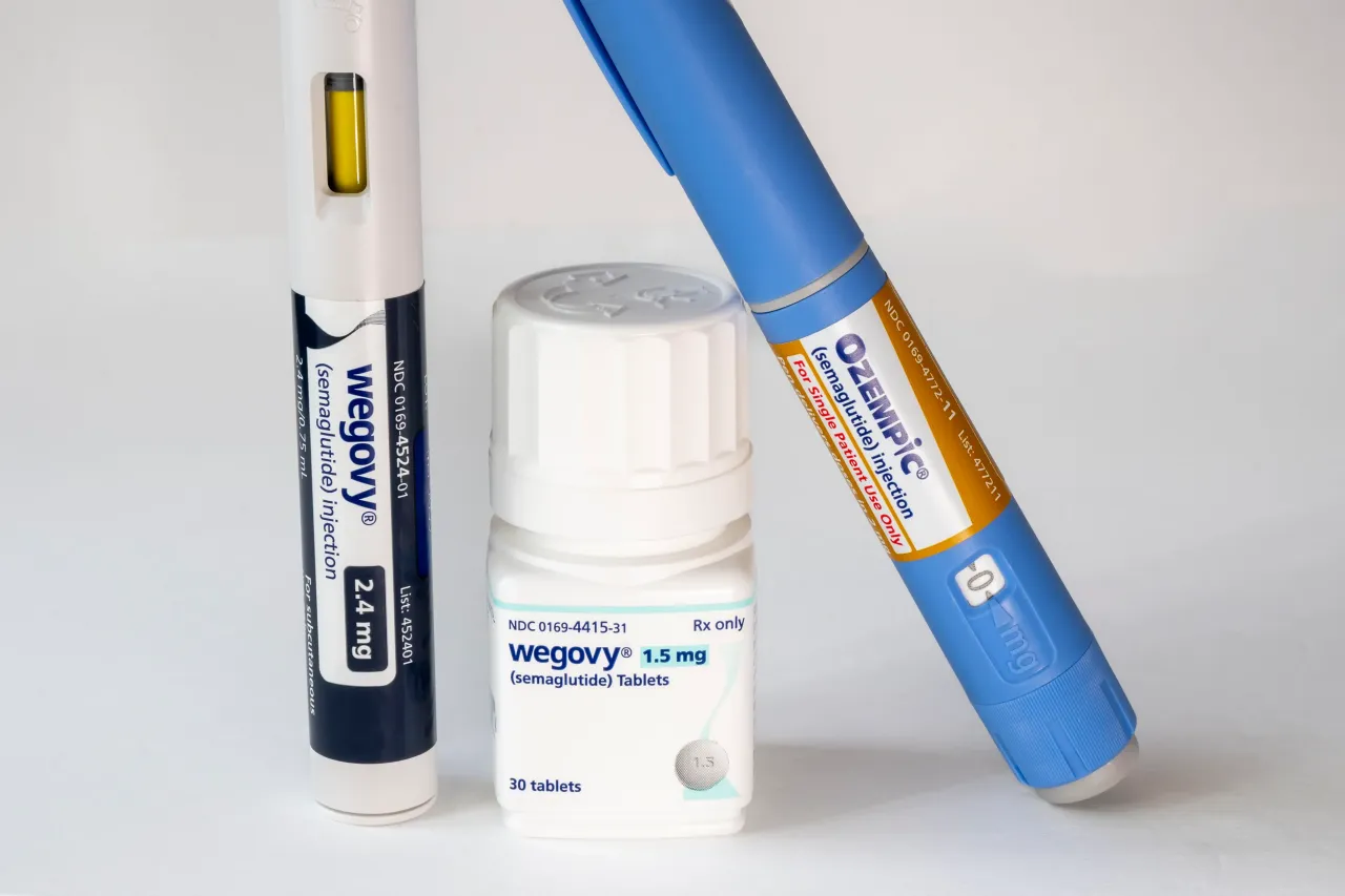 Still life of Novo Nordisk's Wegovy semaglutide tablets with injectable prescription weight loss medicines, Ozempic, and Wegovy