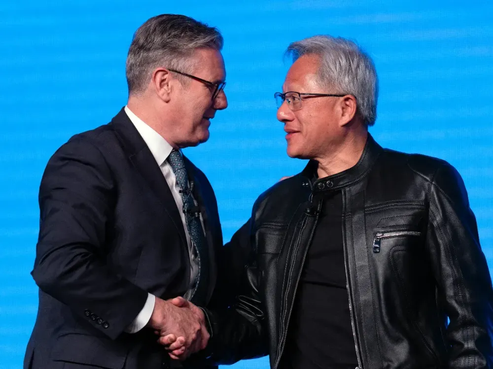 British Prime Minister, Keir Starmer (L) shakes hands with Jensen Huang, CEO of Nvidia, after a panel discussion at London Tech Week on June 9, 2025 in London, England. (Photo by Carl Court/Getty Images) 