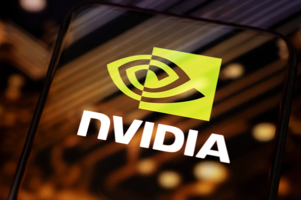 In this photographic illustration, the Nvidia logo appears on a smartphone reflecting an illustration of printed circuit boards in Creteil, France, on September 22, 2025. (Photo by Samuel Boivin/NurPhoto via Getty Images)