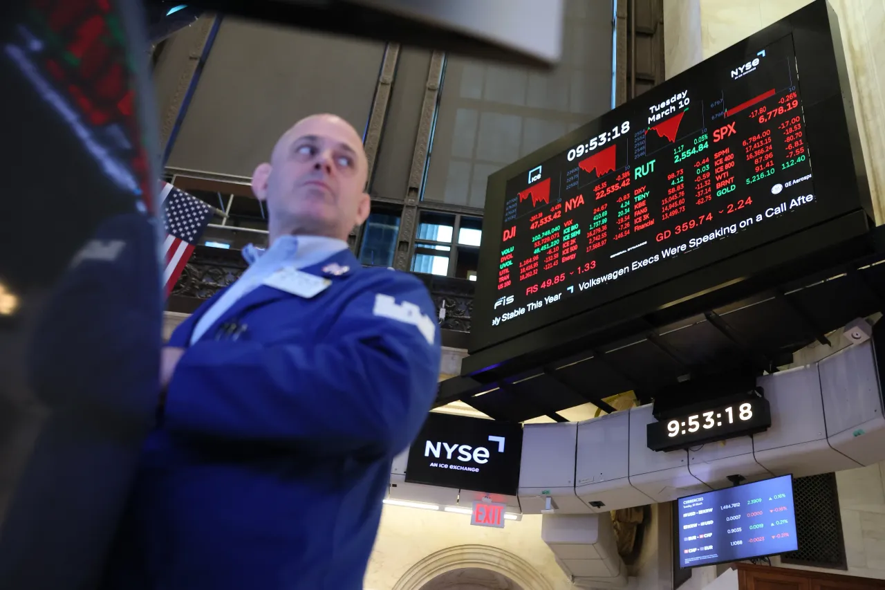 Stock market numbers are displayed as traders work on the floor of the New York Stock Exchange during morning trading on March 10, 2026 in New York City. (Photo by Michael M. Santiago/Getty Images)