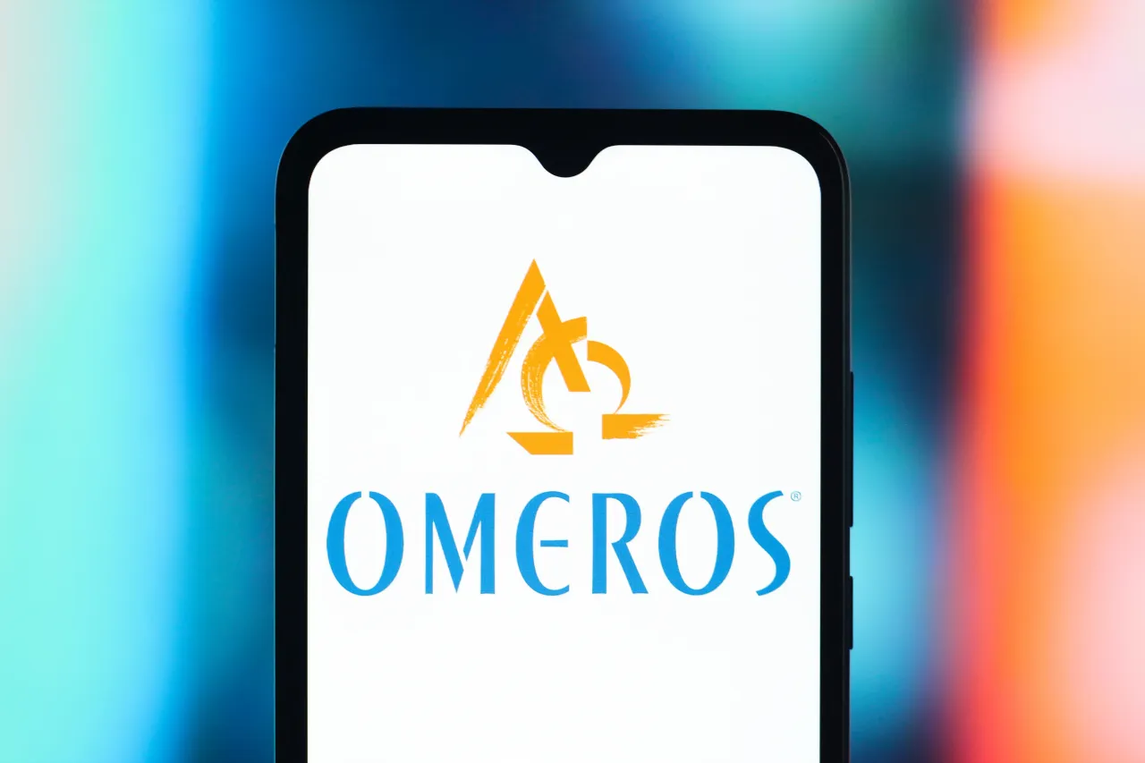 In this photo illustration, the Omeros Corporation logo is seen displayed on a smartphone screen. (Photo Illustration by Thomas Fuller/SOPA Images/LightRocket via Getty Images)