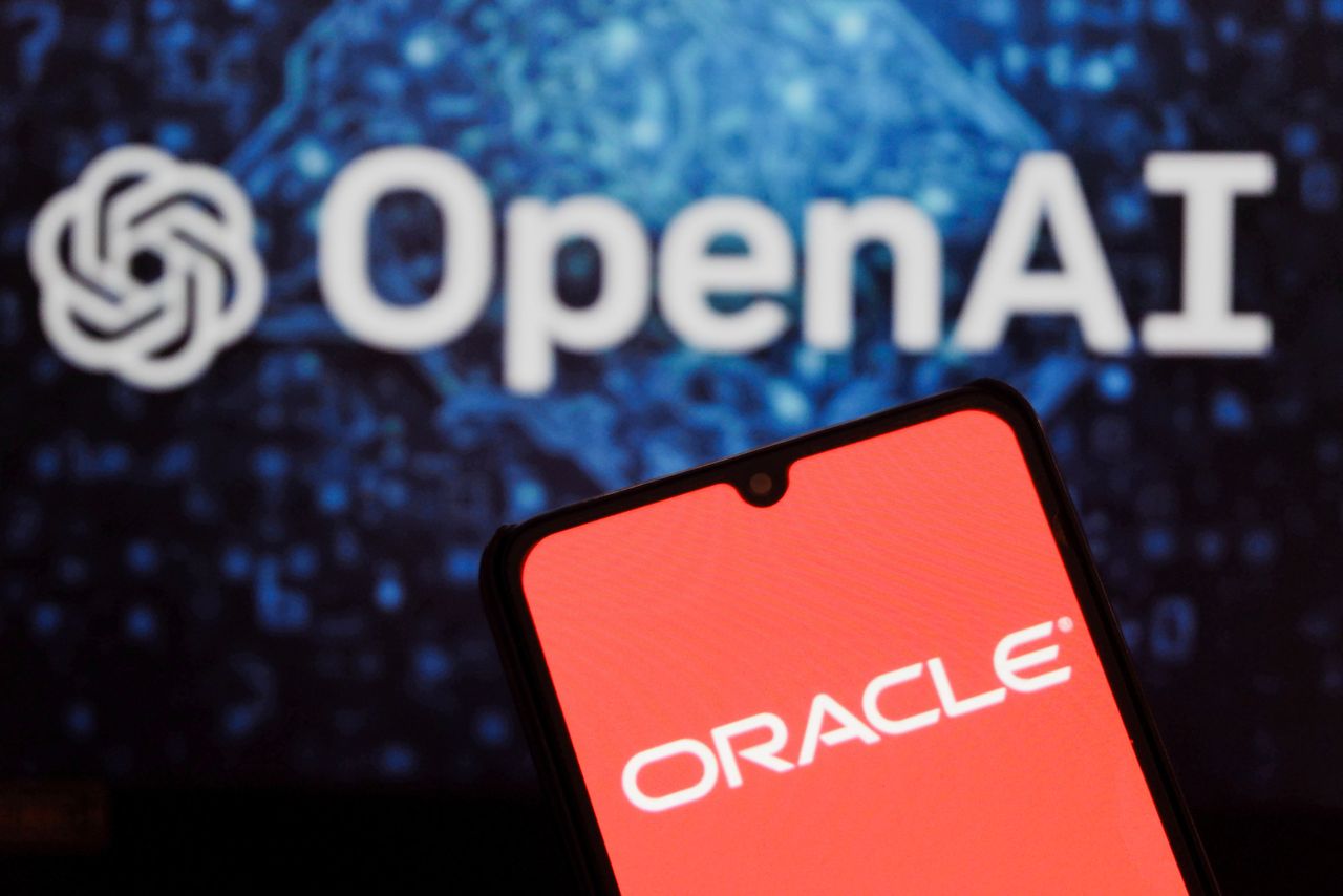 In this photo illustration, the ORACLE logo displayed on a smartphone with the OpenAI logo in the background. (Photo Illustration by Algi Febri Sugita/SOPA Images/LightRocket via Getty Images)
