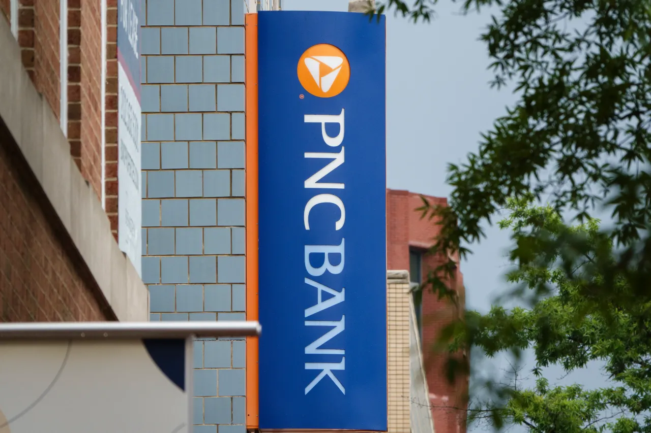 A PNC Bank logo is displayed on a sign outside of a branch on May 31, 2025 in Washington, DC. (Photo by Kevin Carter/Getty Images)