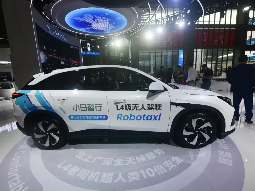 Visitors are viewing an L4-level driverless electric vehicle at the Pony.ai booth at the 2025 Shanghai International Auto Show in Shanghai, China on April 24, 2025. (Photo credit should read CFOTO/Future Publishing via Getty Images)